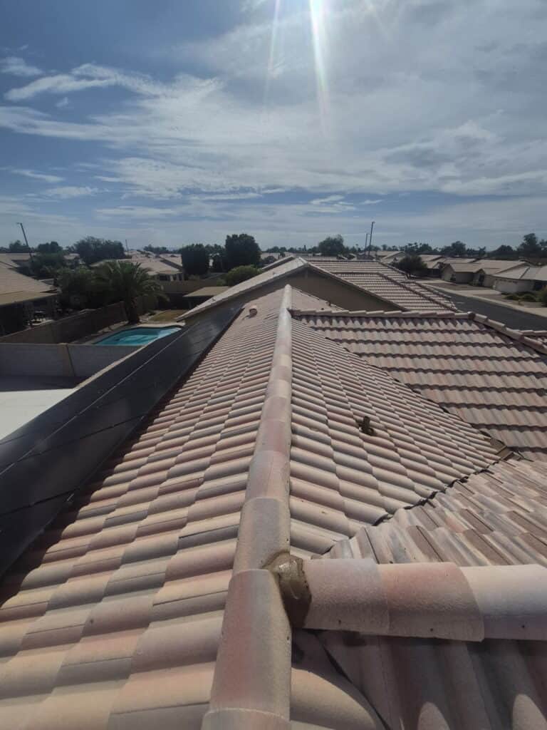 Residential roof with clay tiles under a sunny sky in Phoenix, Arizona.